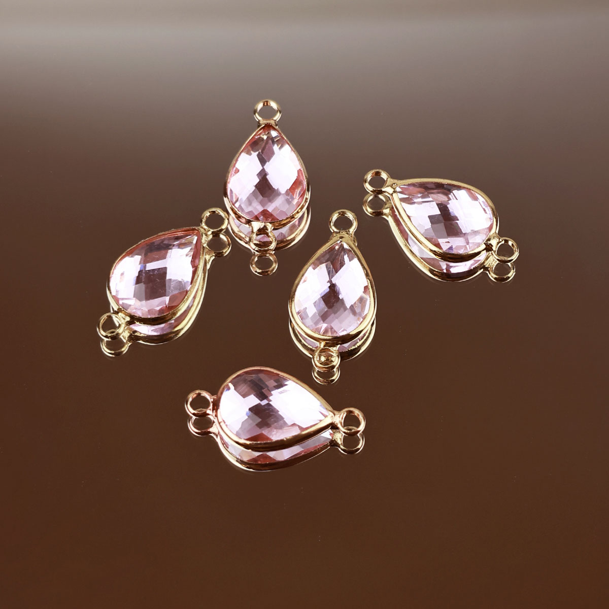 Подвеска (соединитель для бижутерии) (уп. 10шт) капля прозрачная 10*14 мм 009 розовый