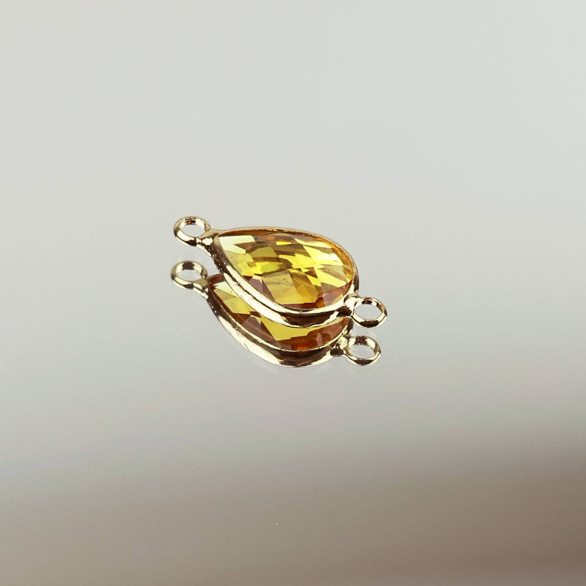 Подвеска (соединитель для бижутерии) (уп. 10шт) капля прозрачная 10*14 мм 018 желтый