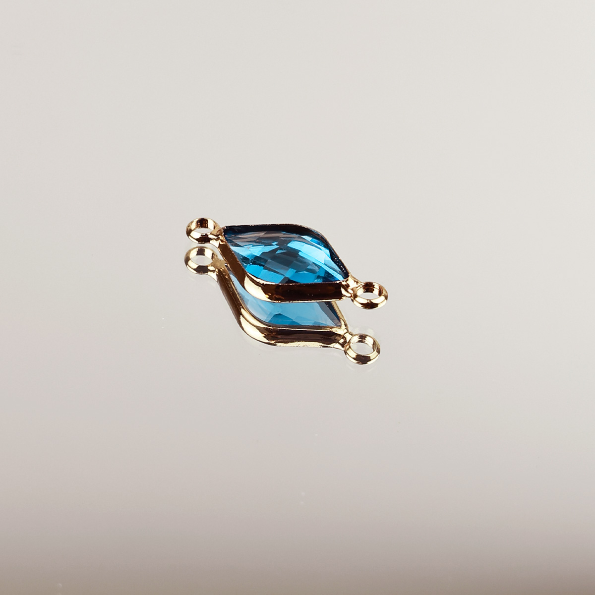 Подвеска (соединитель для бижутерии) (уп. 10шт) ромб прозрачный 10*14 мм бирюза