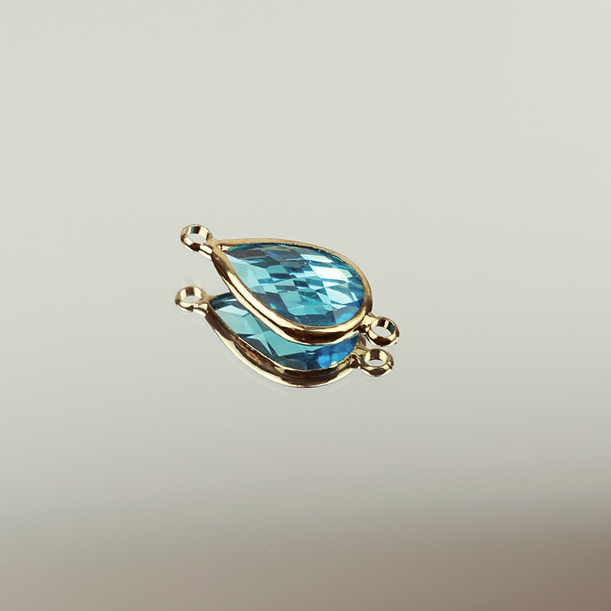 Подвеска (соединитель для бижутерии) (уп. 10шт) капля прозрачная 10*14 мм бирюза